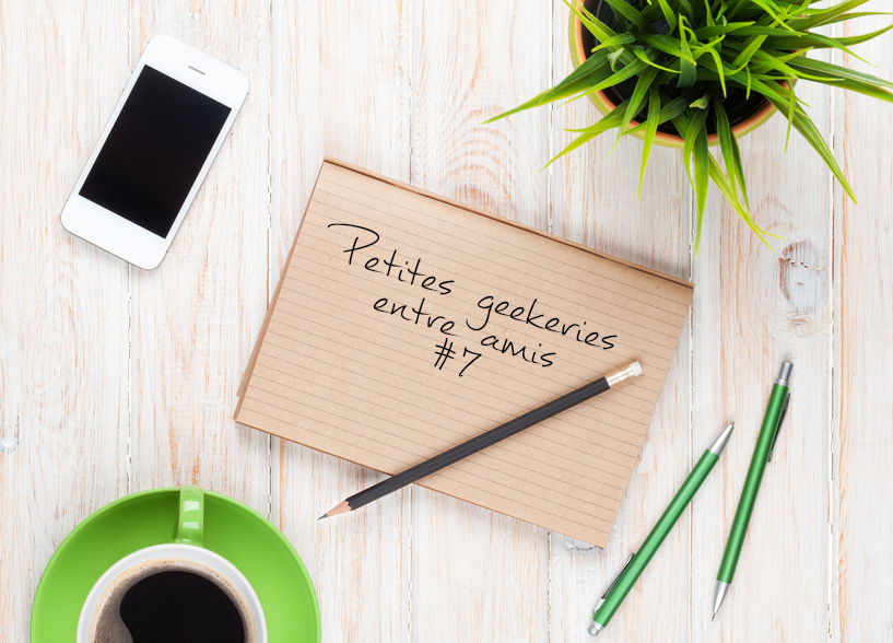 Office desk table with supplies, coffee cup and flower